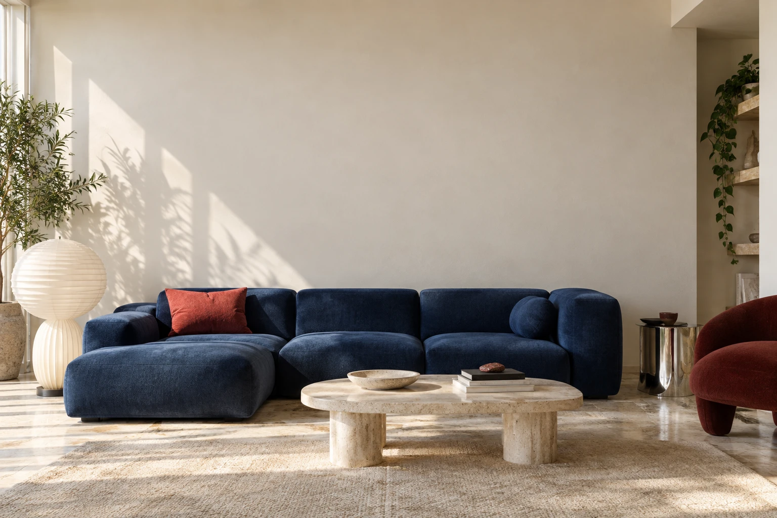 Inside the studio: a modern room with a cobalt sofa and a print on the wall